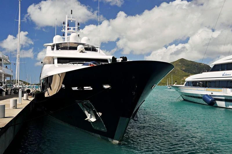 a boat docked at a pier aboard ODESSA Yacht for Charter