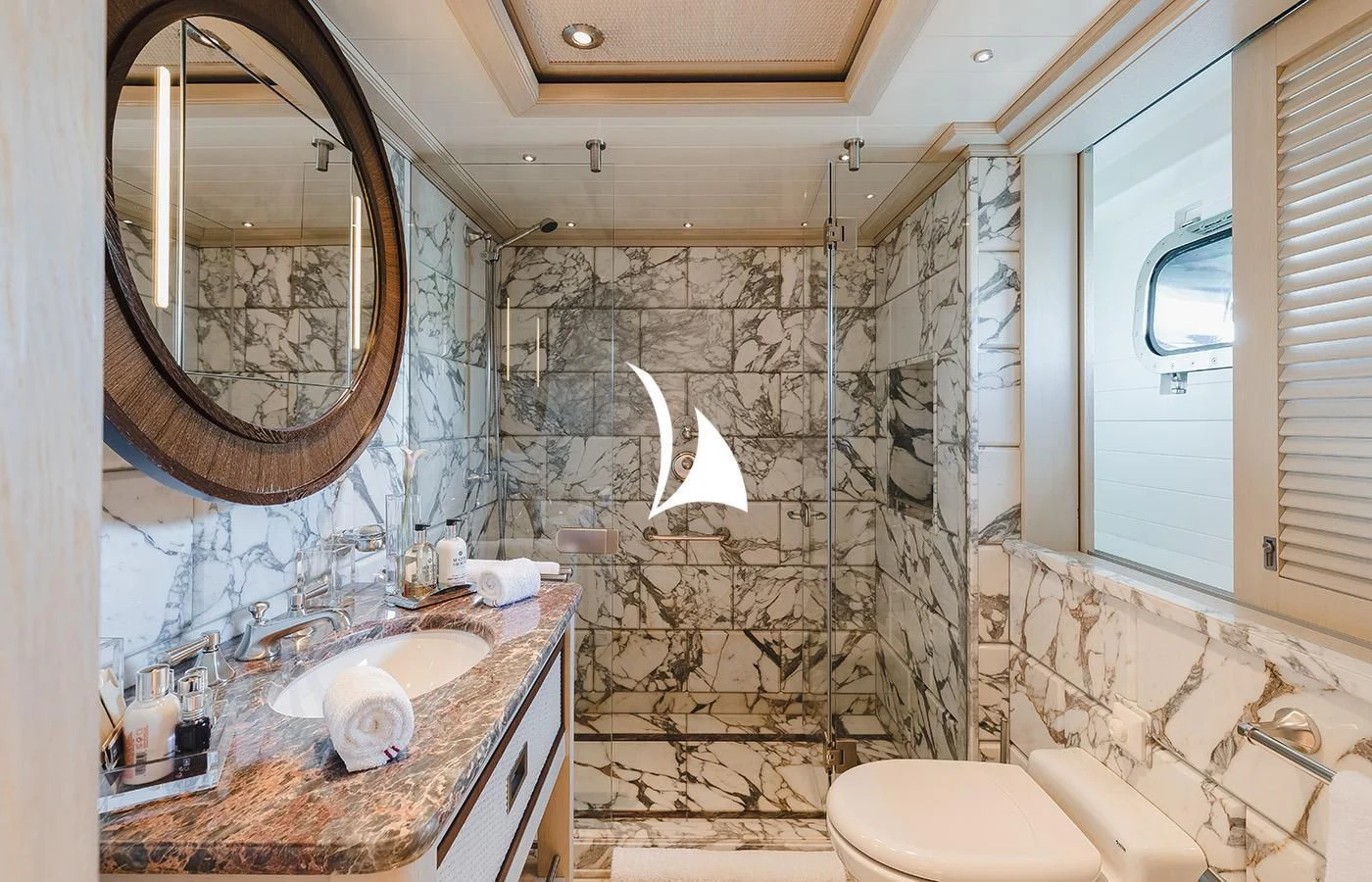 a bathroom with a marble shower aboard ODESSA Yacht for Charter