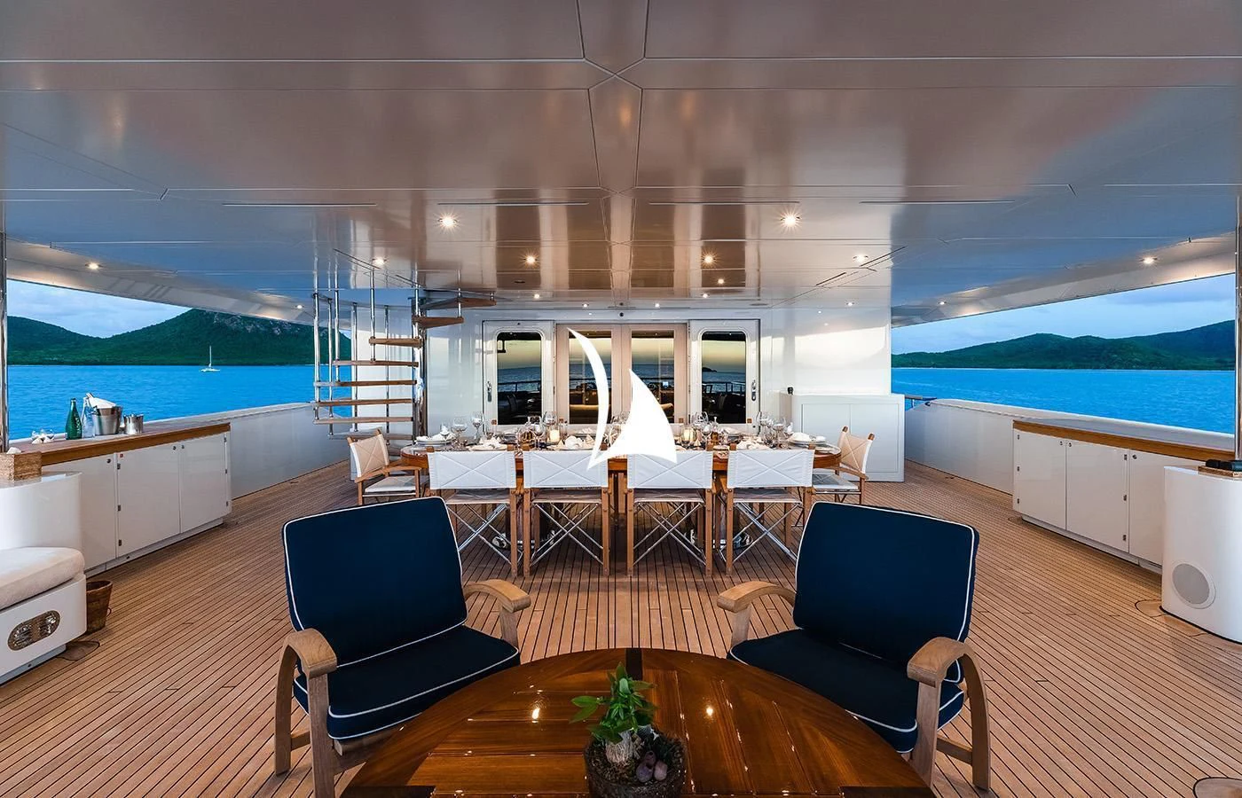 a modern looking living room with a large open window aboard ODESSA Yacht for Charter
