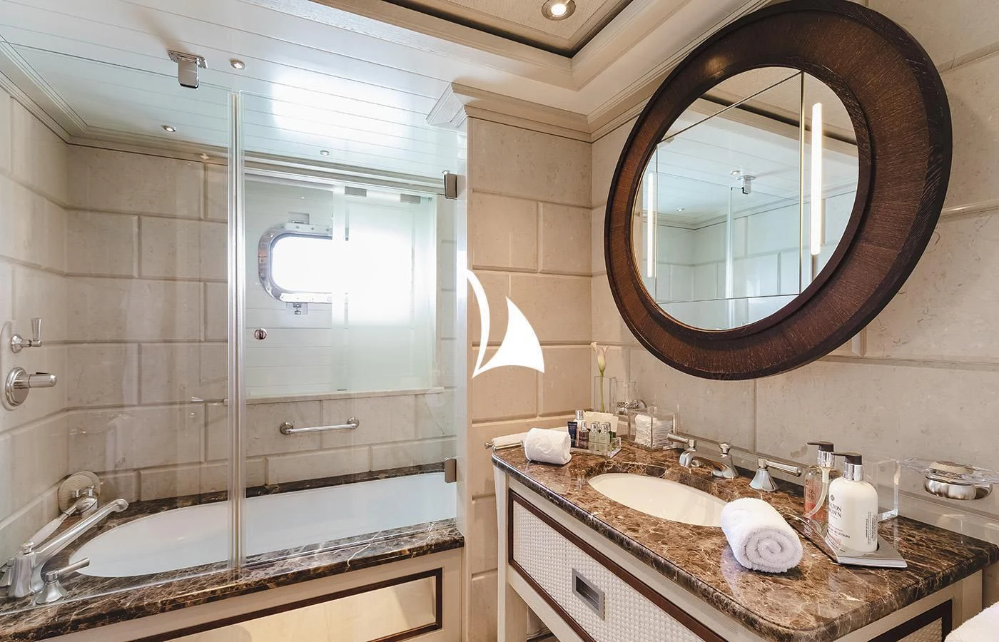 a bathroom with a large mirror aboard ODESSA Yacht for Charter