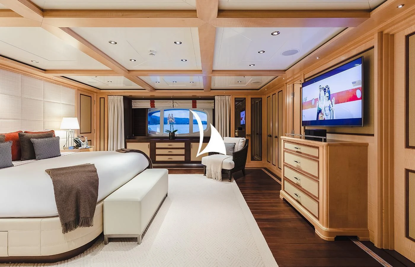 a room with a bed and a tv aboard ODESSA Yacht for Charter