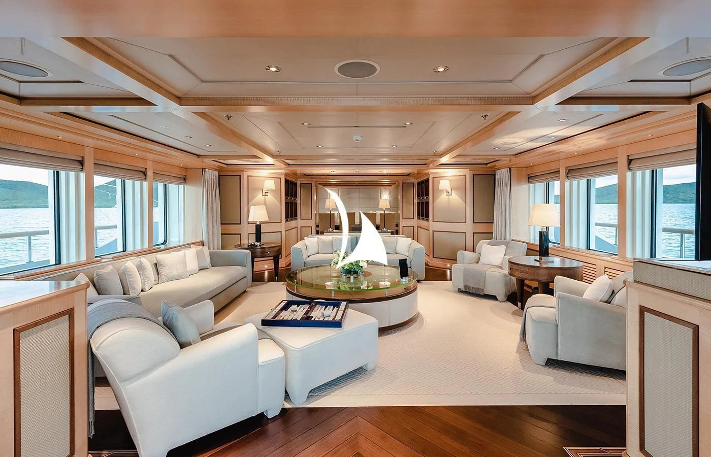 a living room with a large window aboard ODESSA Yacht for Charter