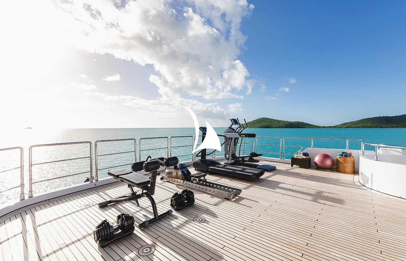 a deck with a pool and a boat on it aboard ODESSA Yacht for Charter