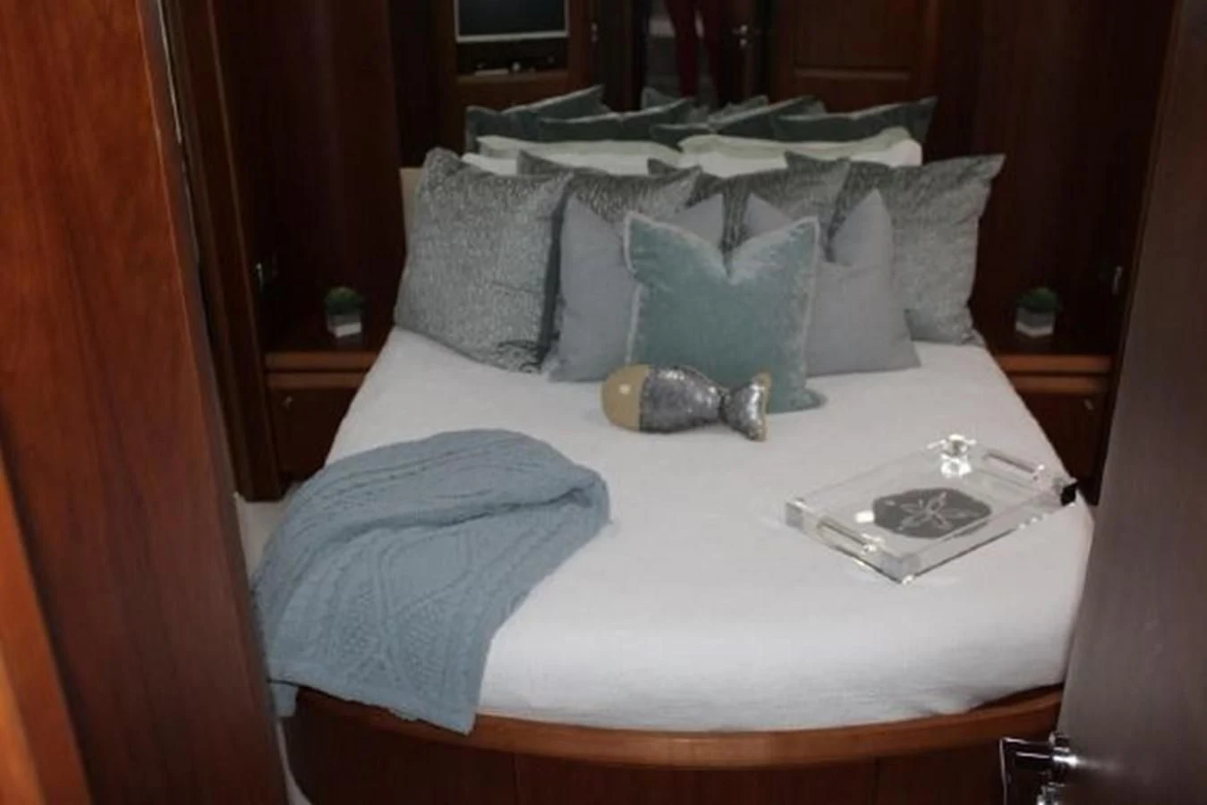 a bed with pillows and a pillow aboard PURA VIDA Yacht for Sale