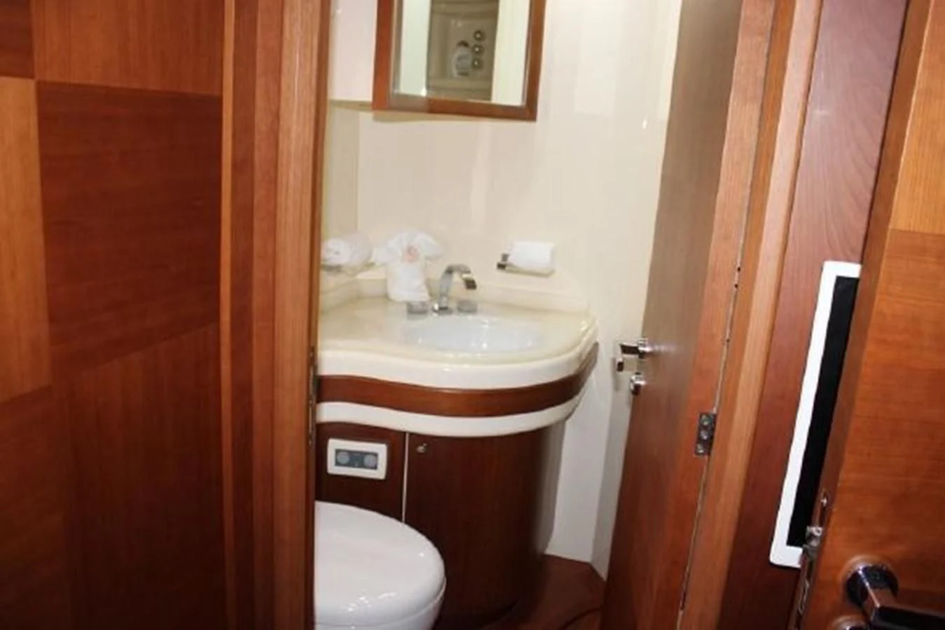 a bathroom with a sink and toilet aboard PURA VIDA Yacht for Sale