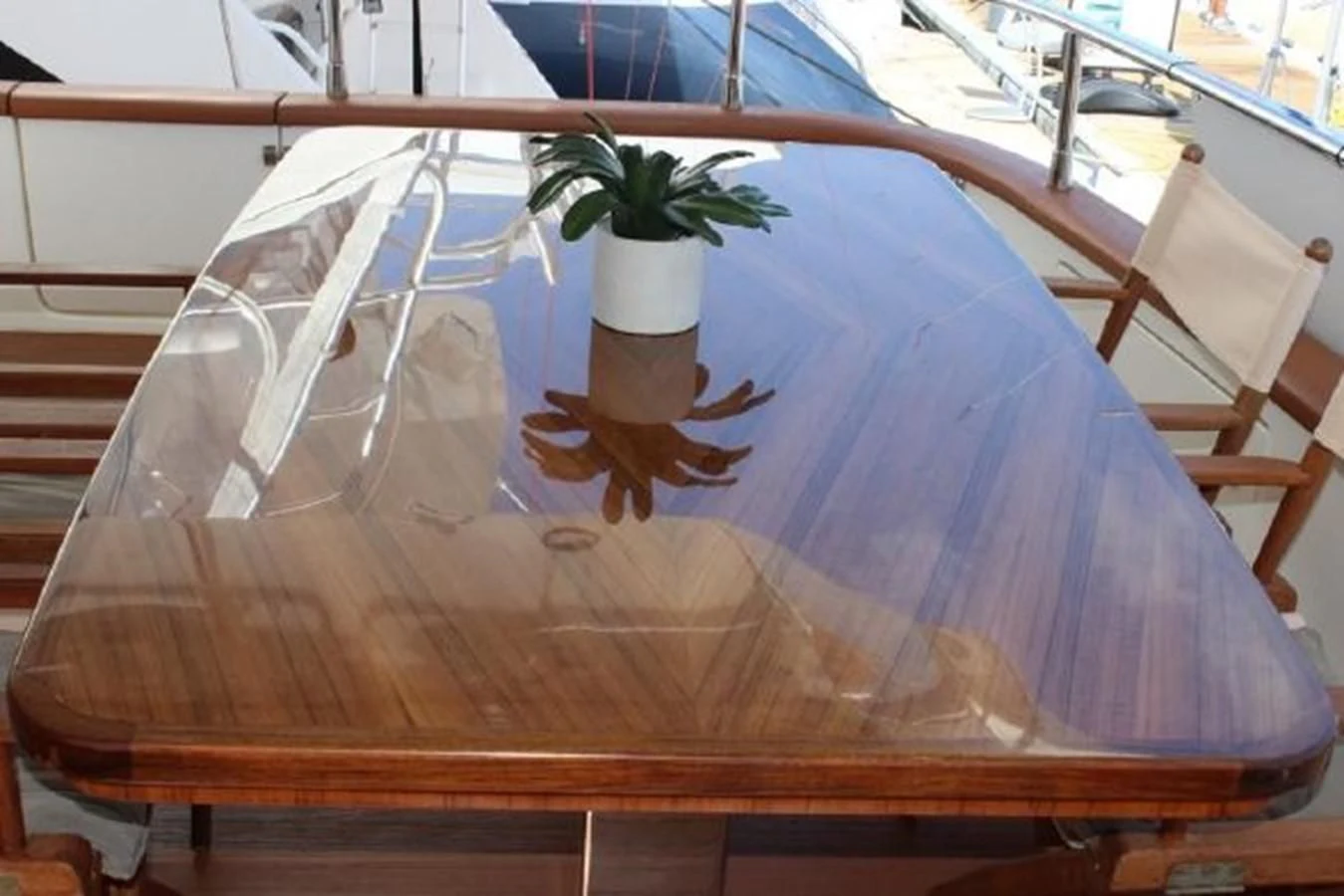 a plant in a pot on a table aboard PURA VIDA Yacht for Sale