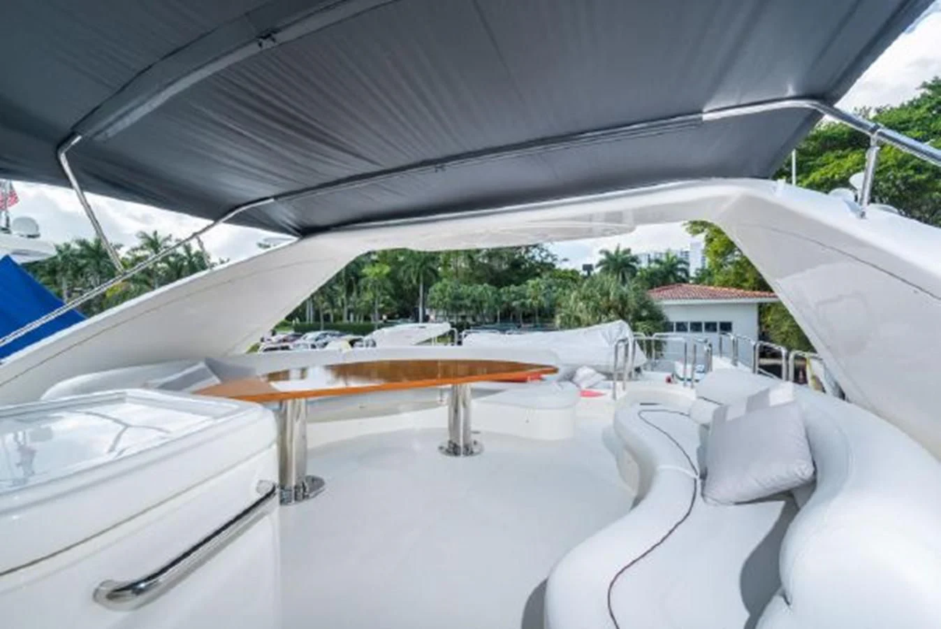 a white tent with a table and chairs on it aboard PURA VIDA Yacht for Sale
