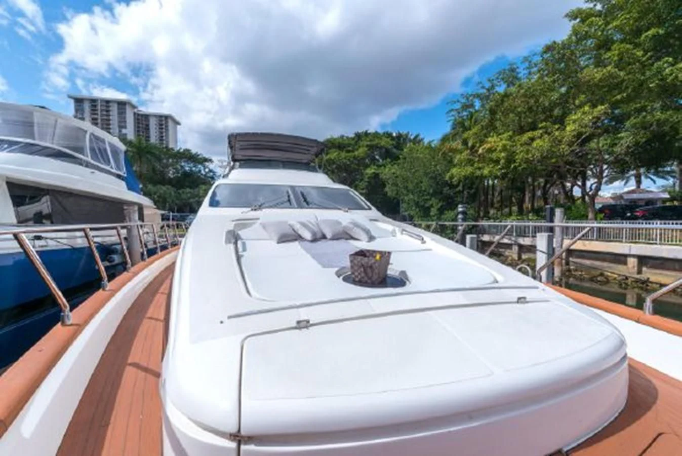 a white boat on a deck aboard PURA VIDA Yacht for Sale