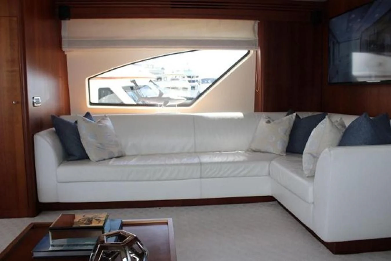 a white couch with pillows aboard PURA VIDA Yacht for Sale