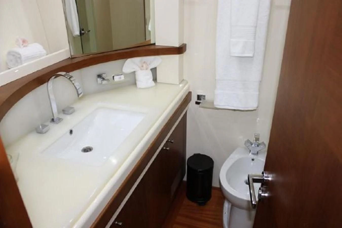 a bathroom with a sink and a mirror aboard PURA VIDA Yacht for Sale