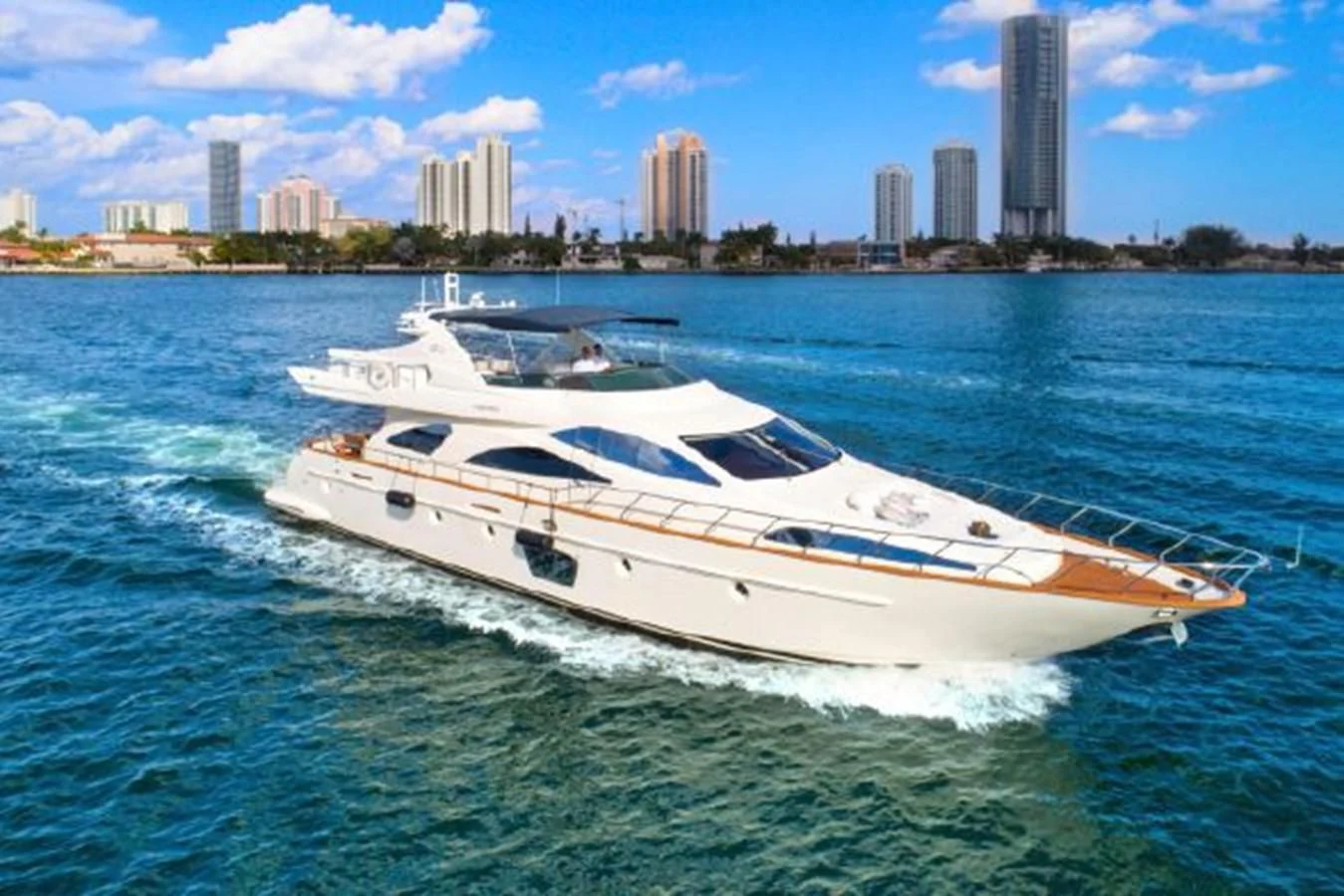 a white yacht on the water aboard PURA VIDA Yacht for Sale