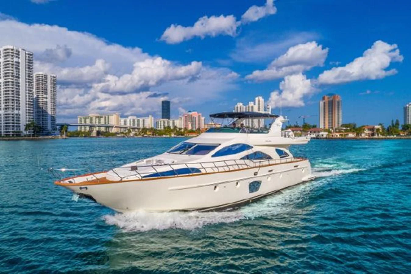 a white boat on the water aboard PURA VIDA Yacht for Sale