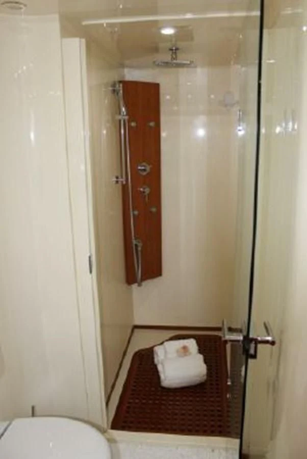 a bathroom with a red rug aboard PURA VIDA Yacht for Sale