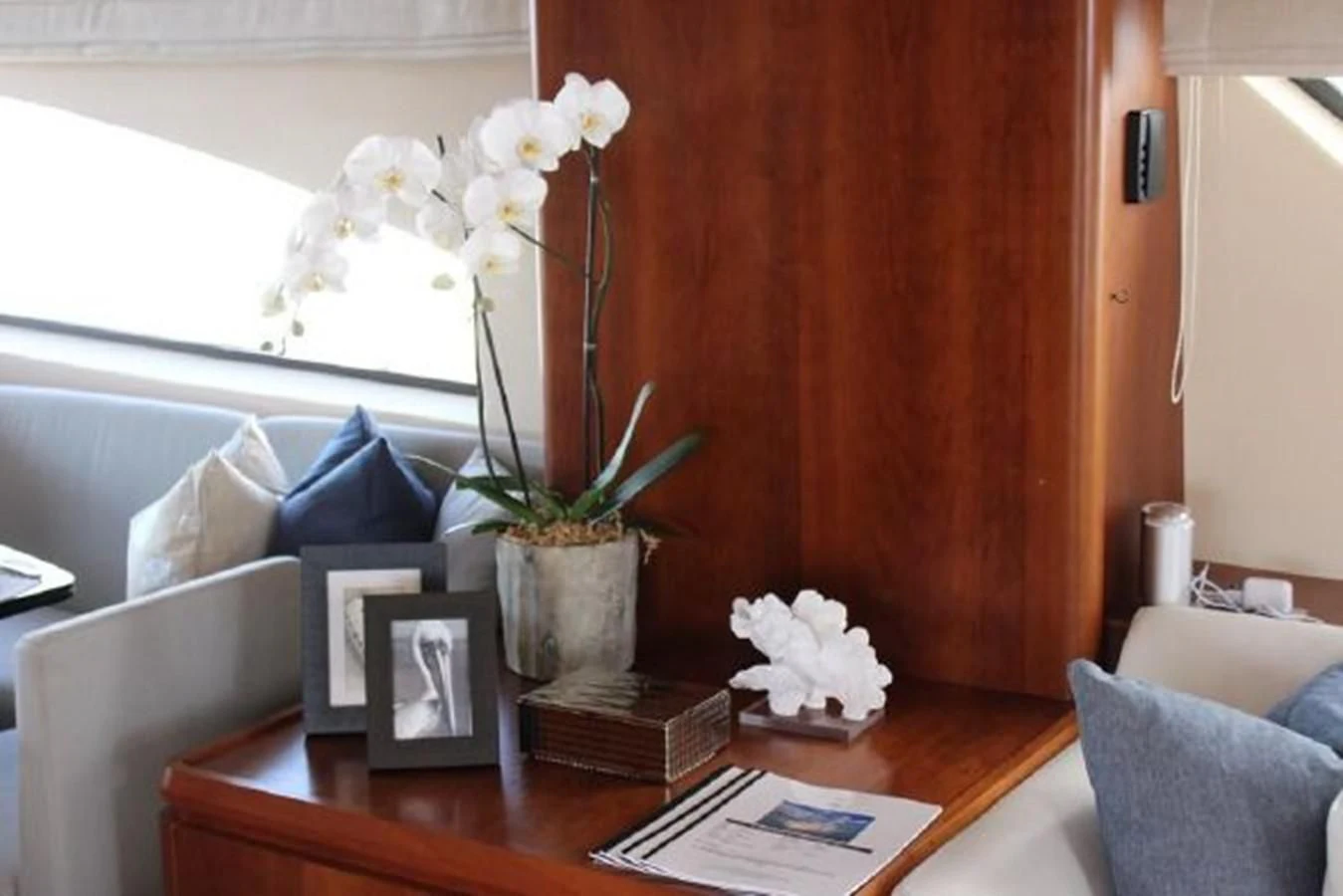 a vase of flowers on a table aboard PURA VIDA Yacht for Sale