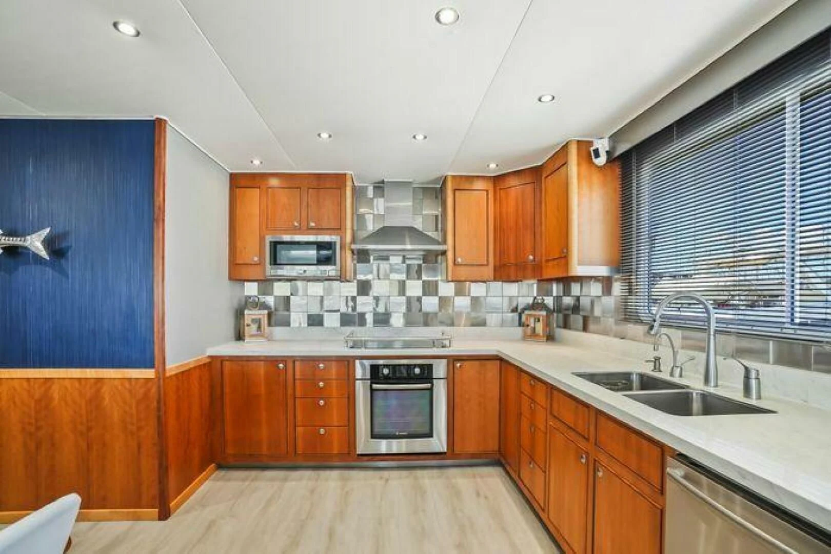 a kitchen with wooden cabinets aboard ISLAND SOUL Yacht for Sale