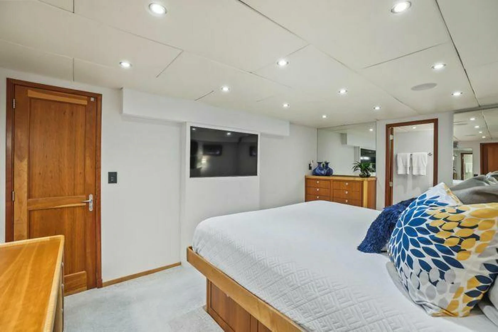 a bedroom with a bed and a television aboard ISLAND SOUL Yacht for Sale