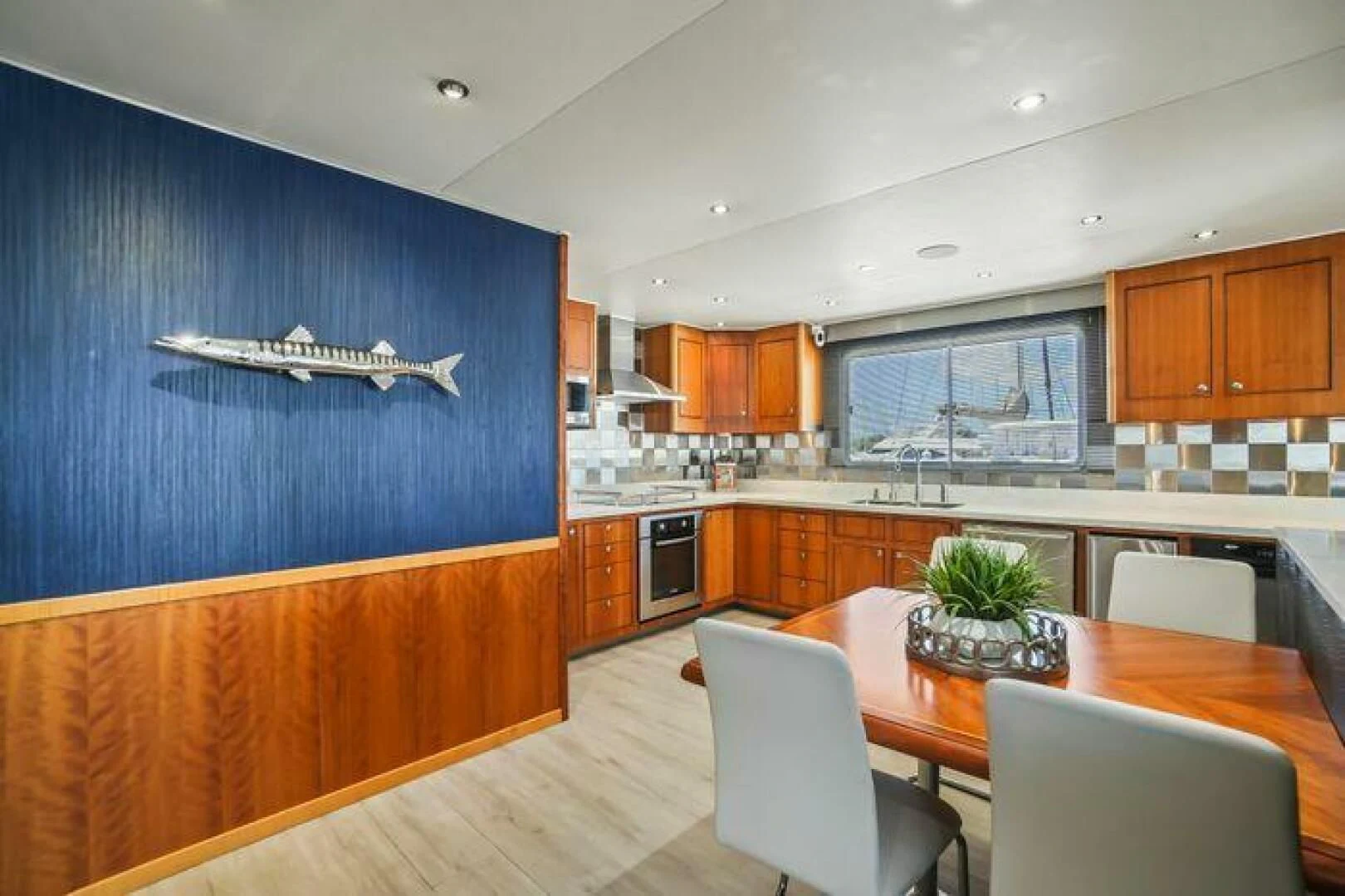 a kitchen with a dining table aboard ISLAND SOUL Yacht for Sale