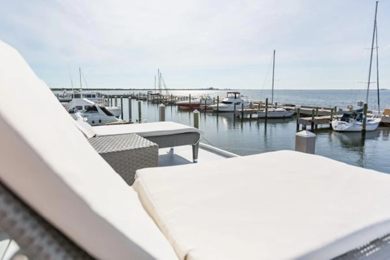 a boat is parked on the side of the water aboard ISLAND SOUL Yacht for Sale
