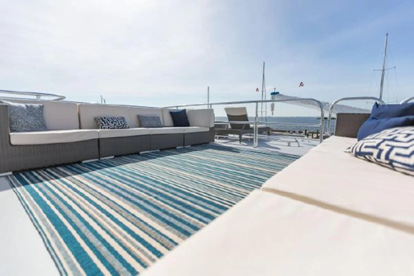 a deck with a pool and lounge chairs on it aboard ISLAND SOUL Yacht for Sale