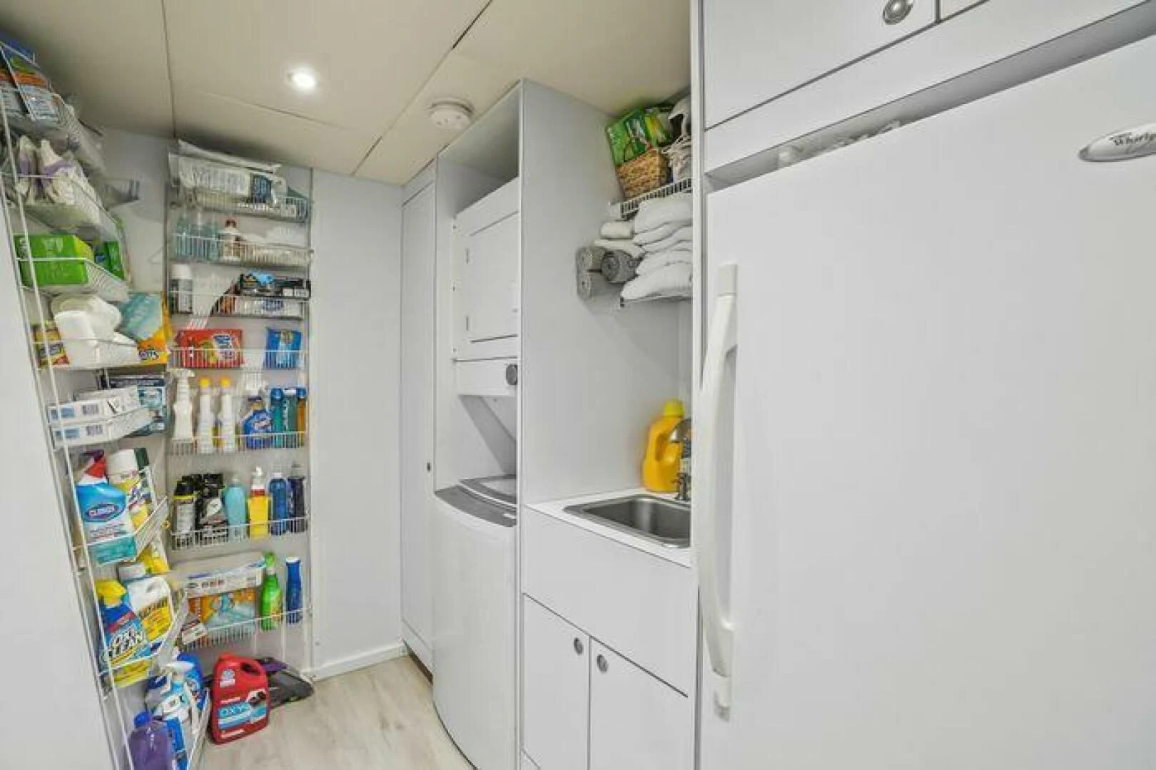 a kitchen with shelves and a sink aboard ISLAND SOUL Yacht for Sale