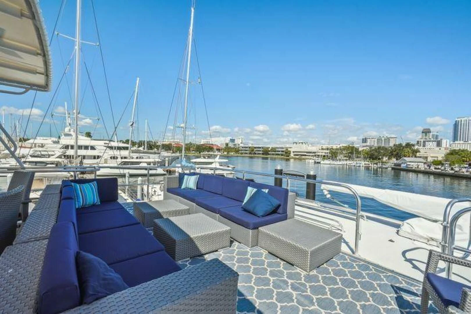 a deck with a pool and a view of a city aboard ISLAND SOUL Yacht for Sale