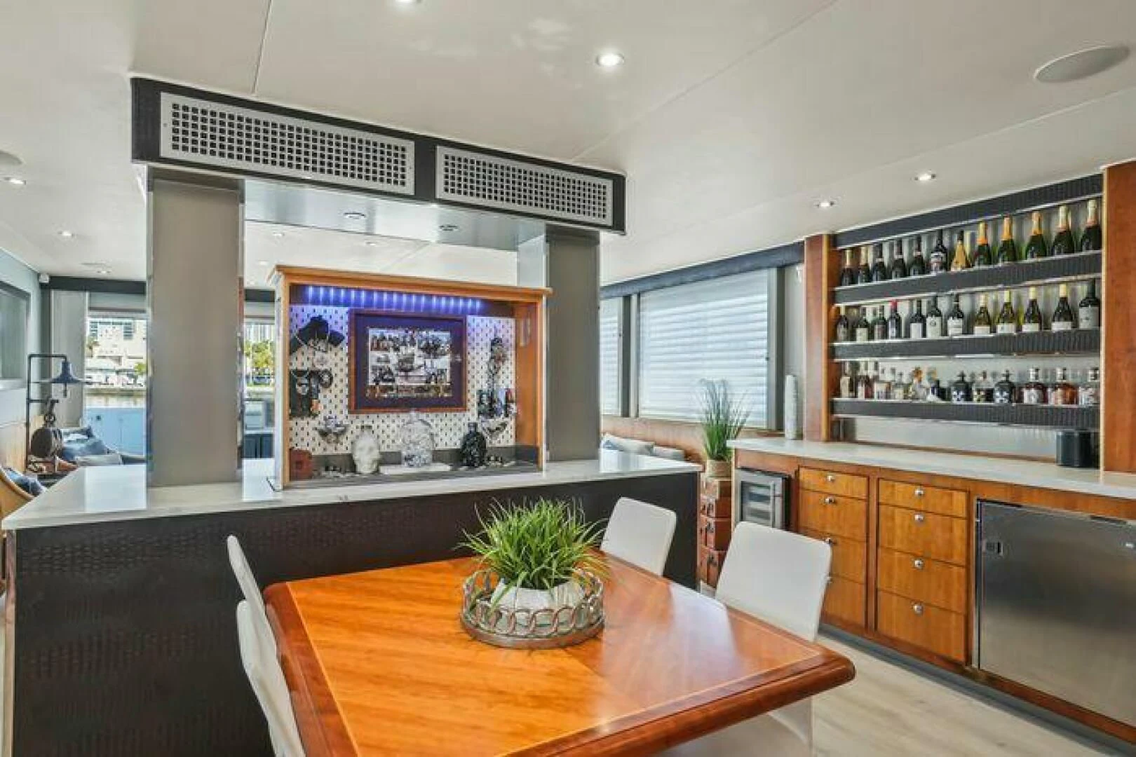 a room with a table and chairs aboard ISLAND SOUL Yacht for Sale