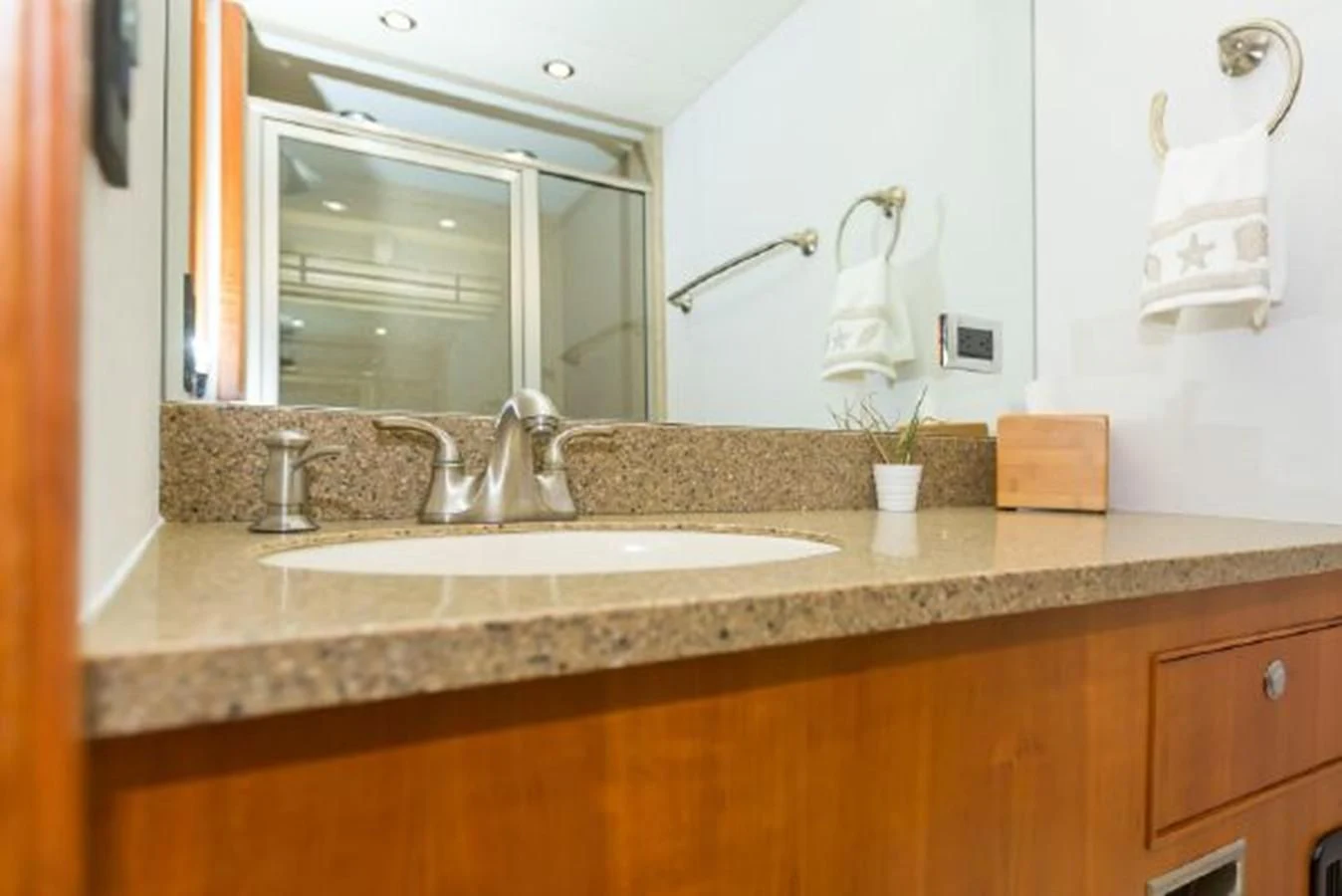 a bathroom with a sink and mirror aboard ISLAND SOUL Yacht for Sale