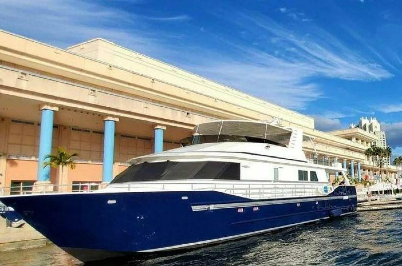 a boat docked in front of a building aboard ISLAND SOUL Yacht for Sale