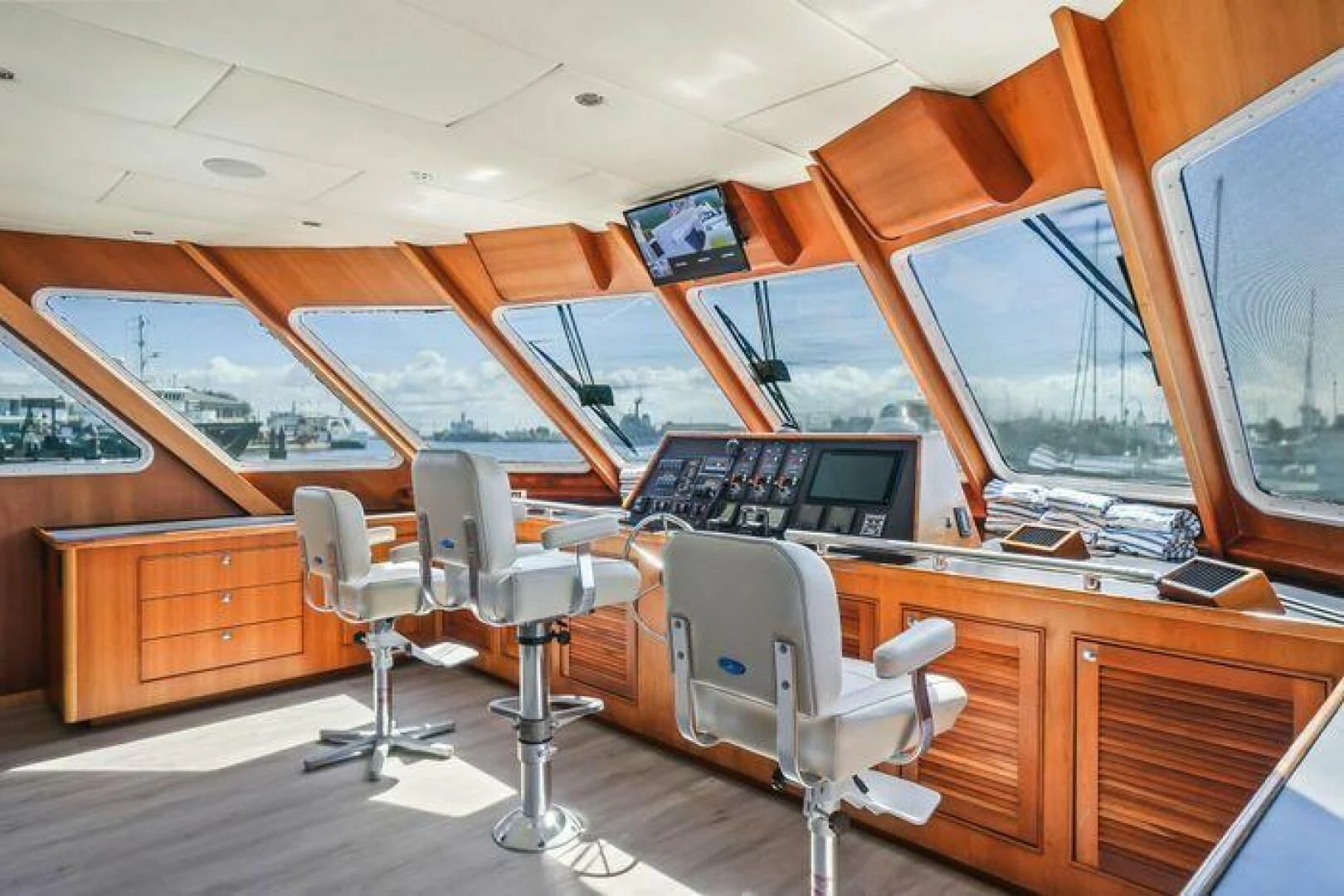 a room with a desk and chairs aboard ISLAND SOUL Yacht for Sale