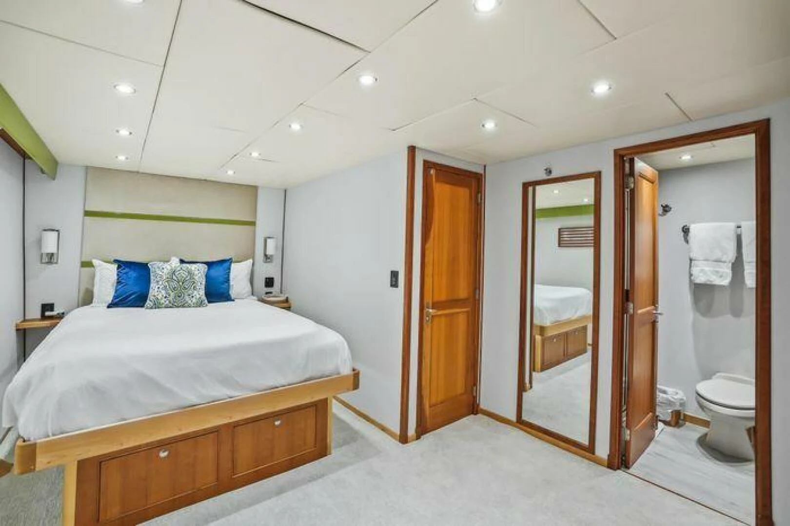 a bedroom with a bed and a closet aboard ISLAND SOUL Yacht for Sale