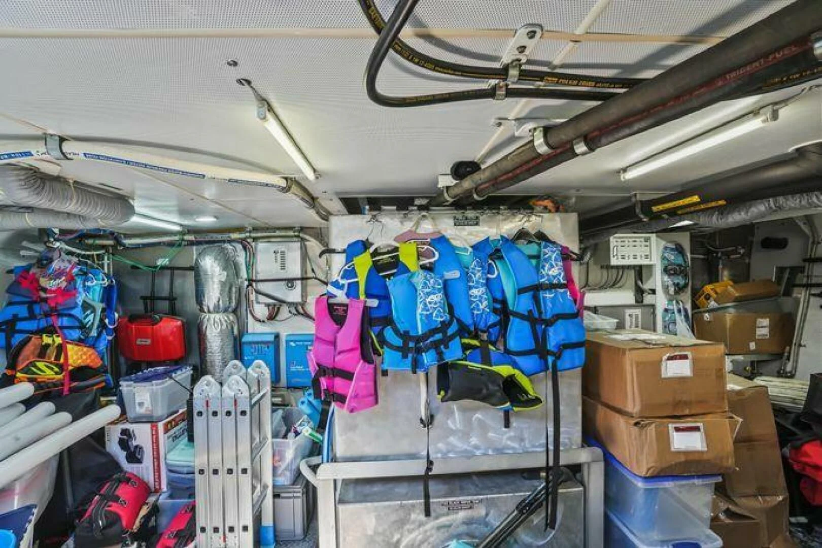 a room full of clothes and boxes aboard ISLAND SOUL Yacht for Sale