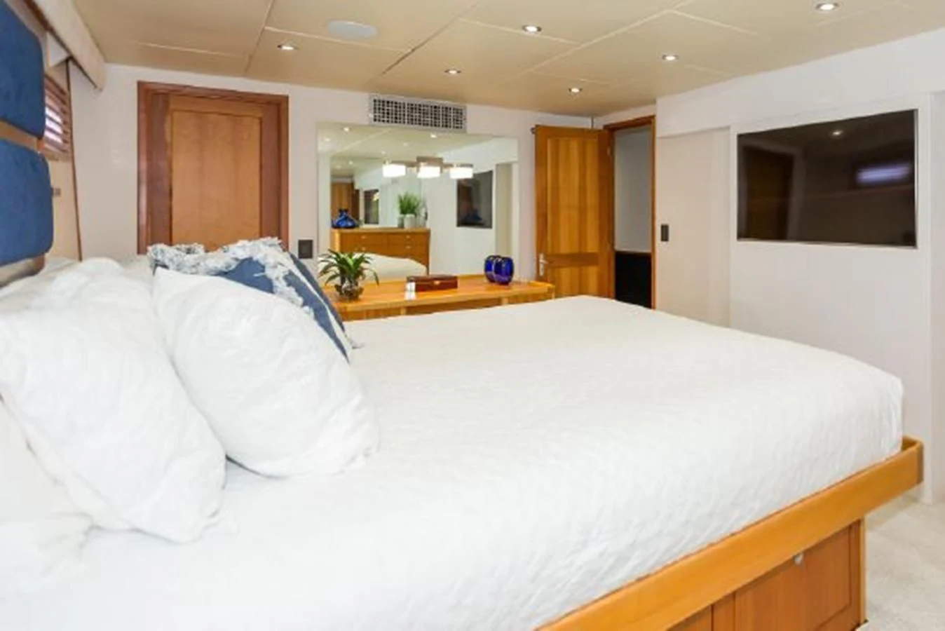 a bed with white sheets aboard ISLAND SOUL Yacht for Sale