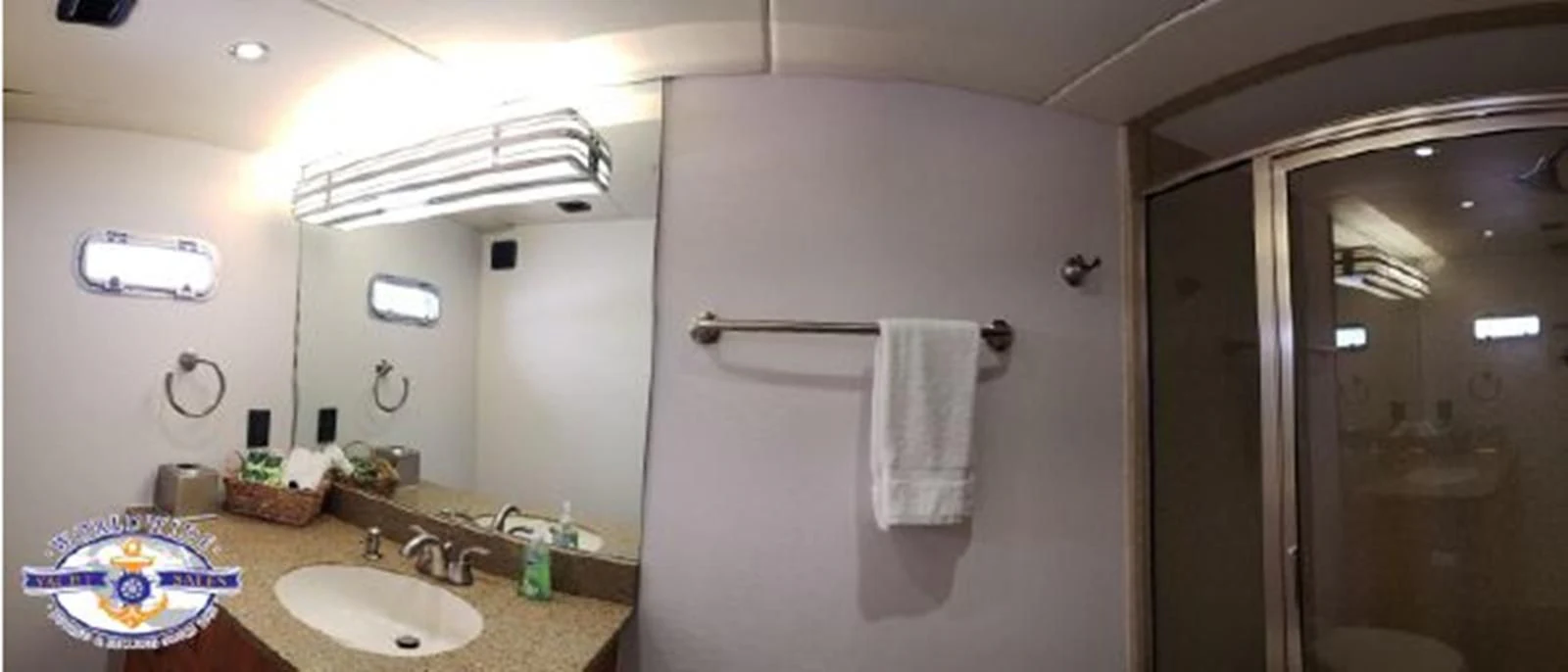 a bathroom with a sink and a mirror aboard ISLAND SOUL Yacht for Sale