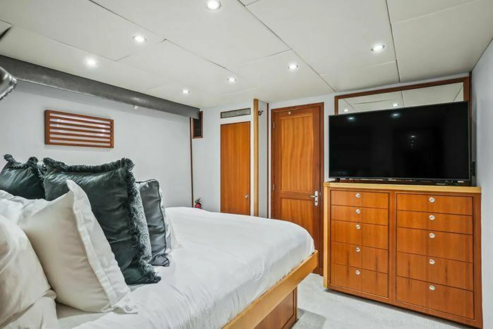 a bedroom with a bed and a tv aboard ISLAND SOUL Yacht for Sale