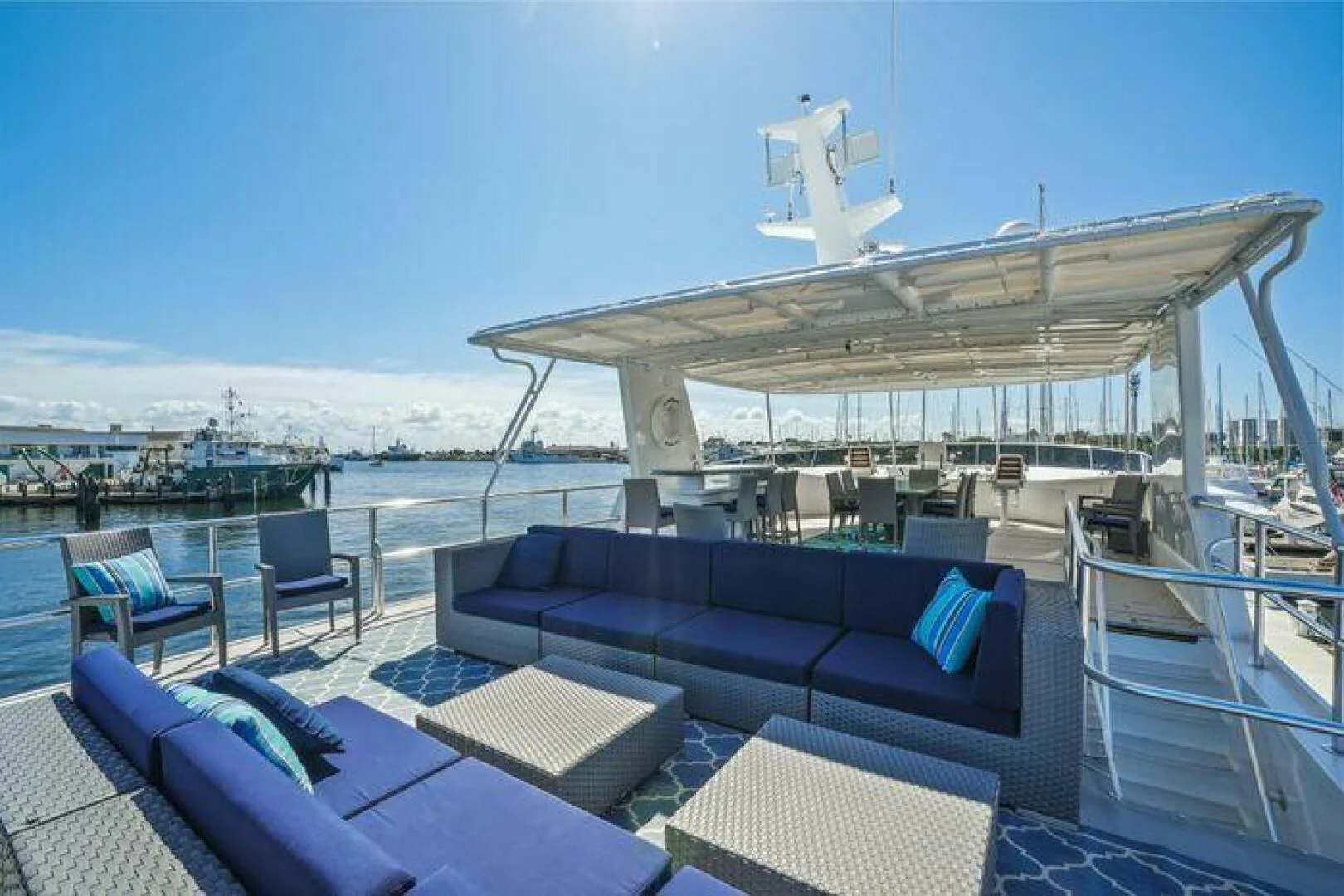 a large white building with a deck and a pool aboard ISLAND SOUL Yacht for Sale