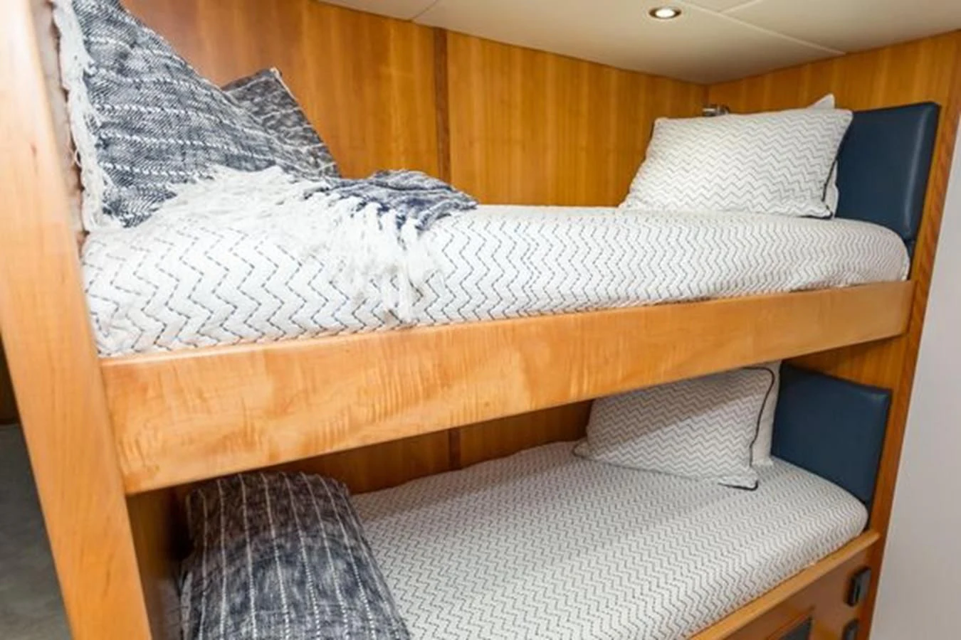 a bed with white sheets aboard ISLAND SOUL Yacht for Sale