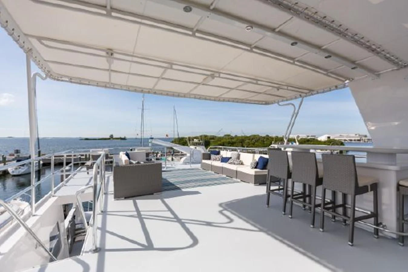 a patio with chairs and tables aboard ISLAND SOUL Yacht for Sale