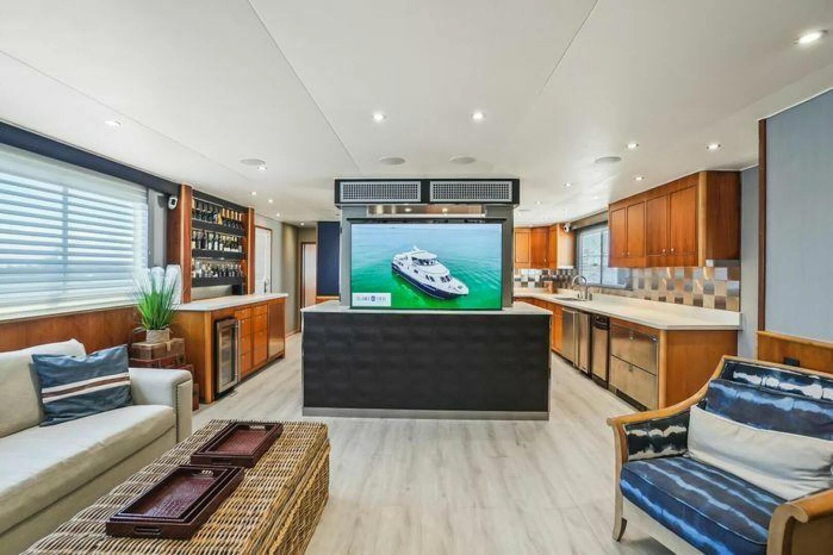 a living room with a large screen aboard ISLAND SOUL Yacht for Sale
