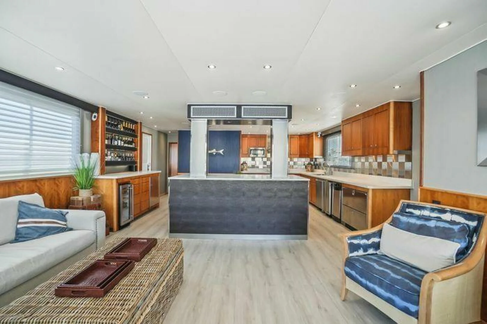 a large living room with a wood floor and a wood floor aboard ISLAND SOUL Yacht for Sale