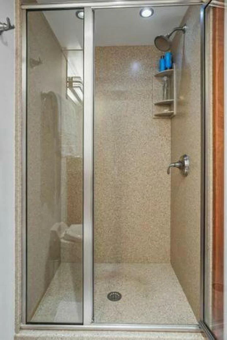 a shower unit with a glass door aboard ISLAND SOUL Yacht for Sale