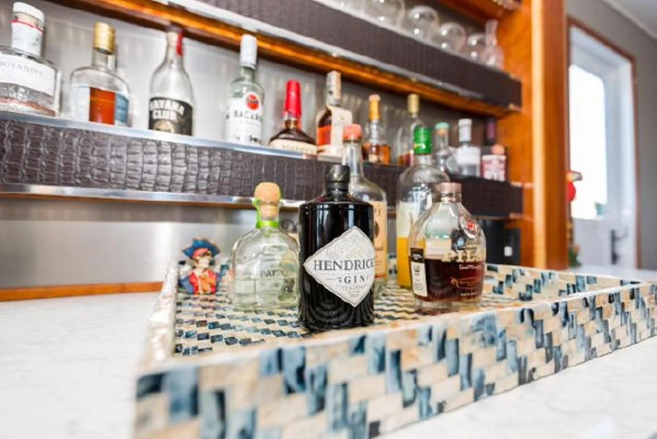 bottles of alcohol on a table aboard ISLAND SOUL Yacht for Sale