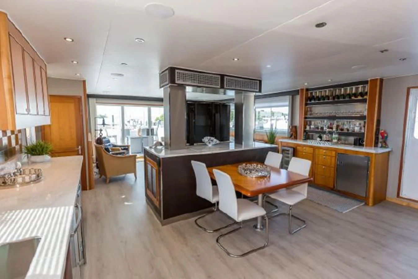 a kitchen with a table and chairs aboard ISLAND SOUL Yacht for Sale