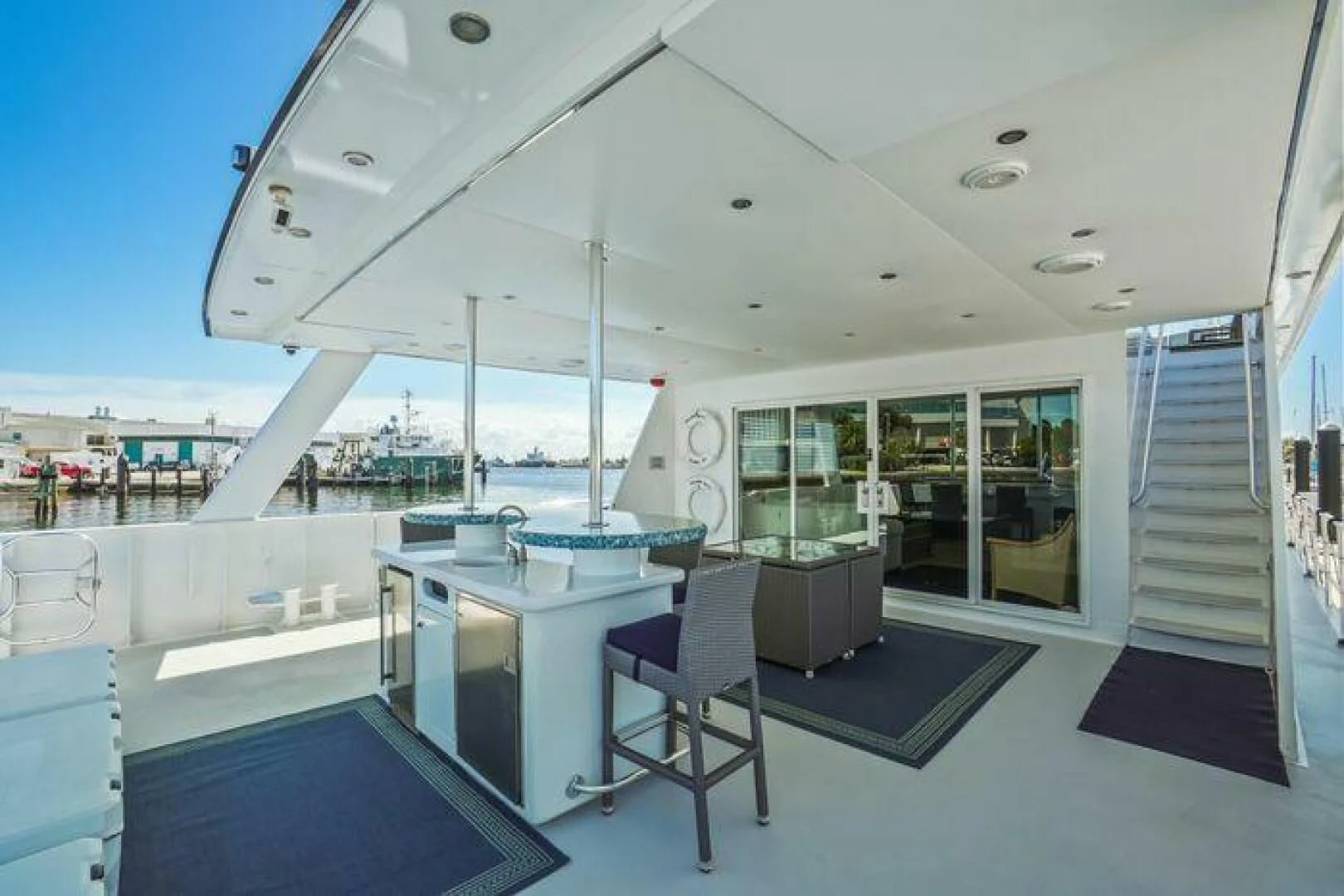 a large white and black room with a pool table and chairs aboard ISLAND SOUL Yacht for Sale
