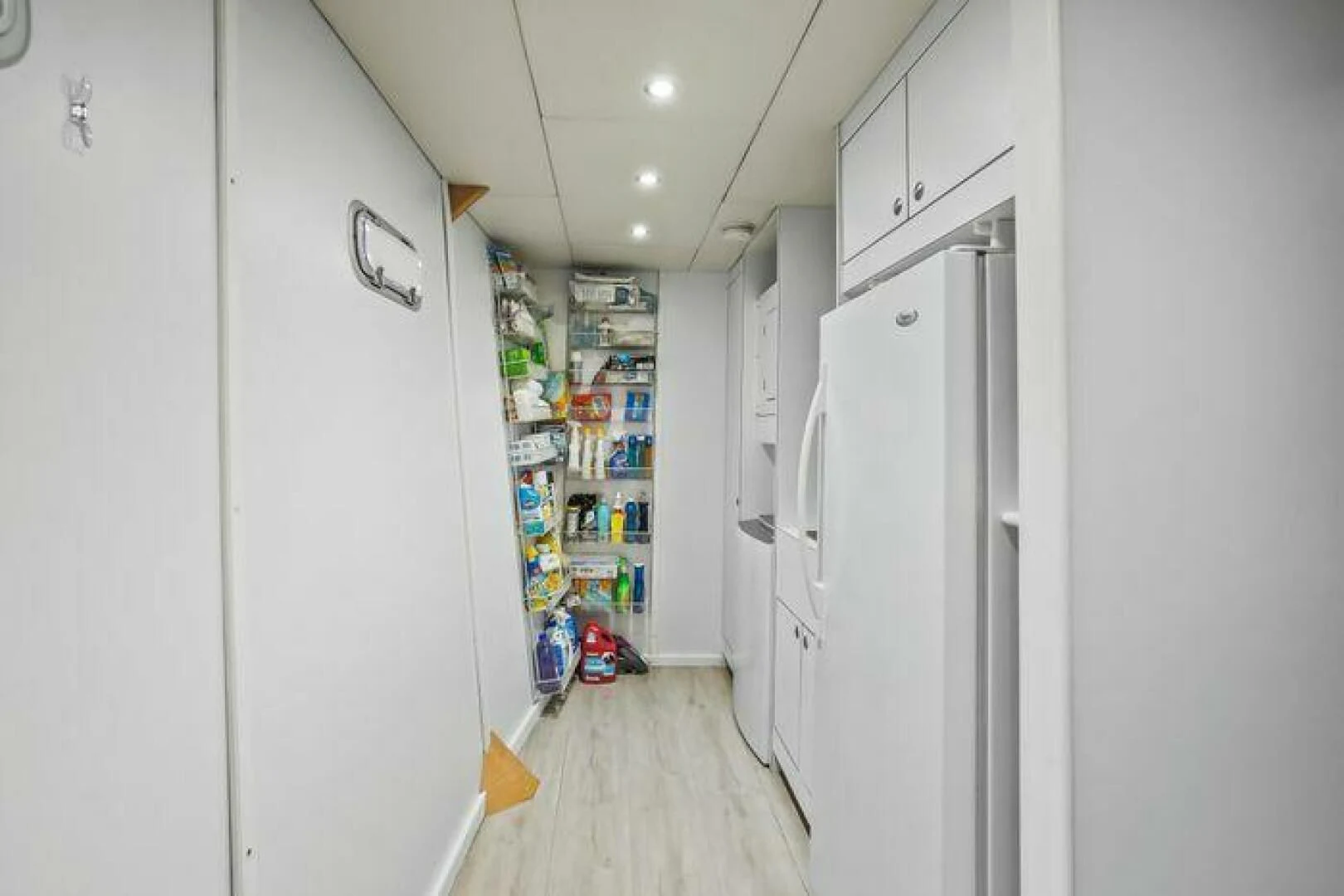 a room with shelves and a refrigerator aboard ISLAND SOUL Yacht for Sale