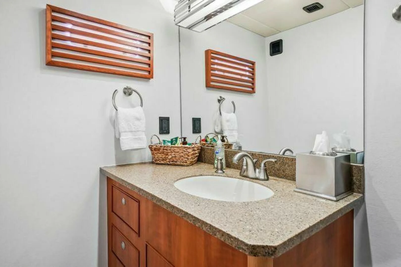 a bathroom with a countertop sink and towels aboard ISLAND SOUL Yacht for Sale