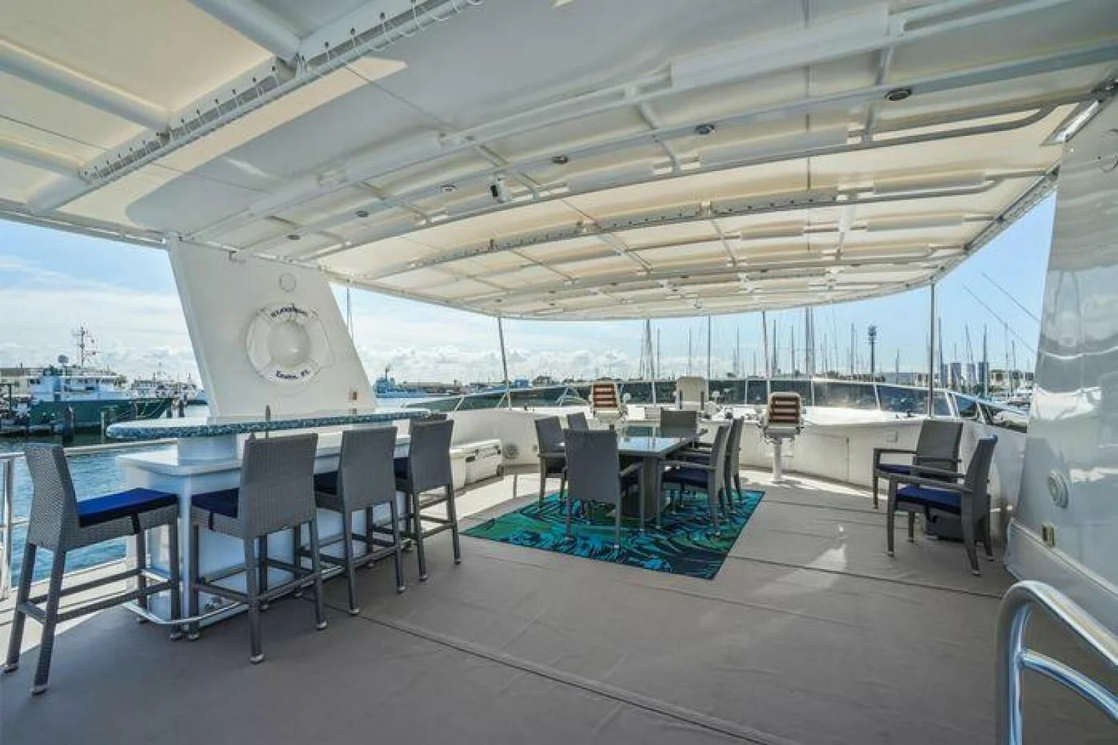 a large room with tables and chairs aboard ISLAND SOUL Yacht for Sale
