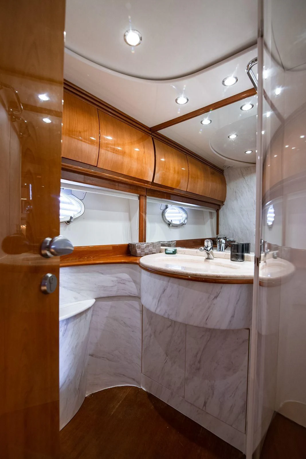 a bathroom with a large mirror aboard AXION Yacht for Charter