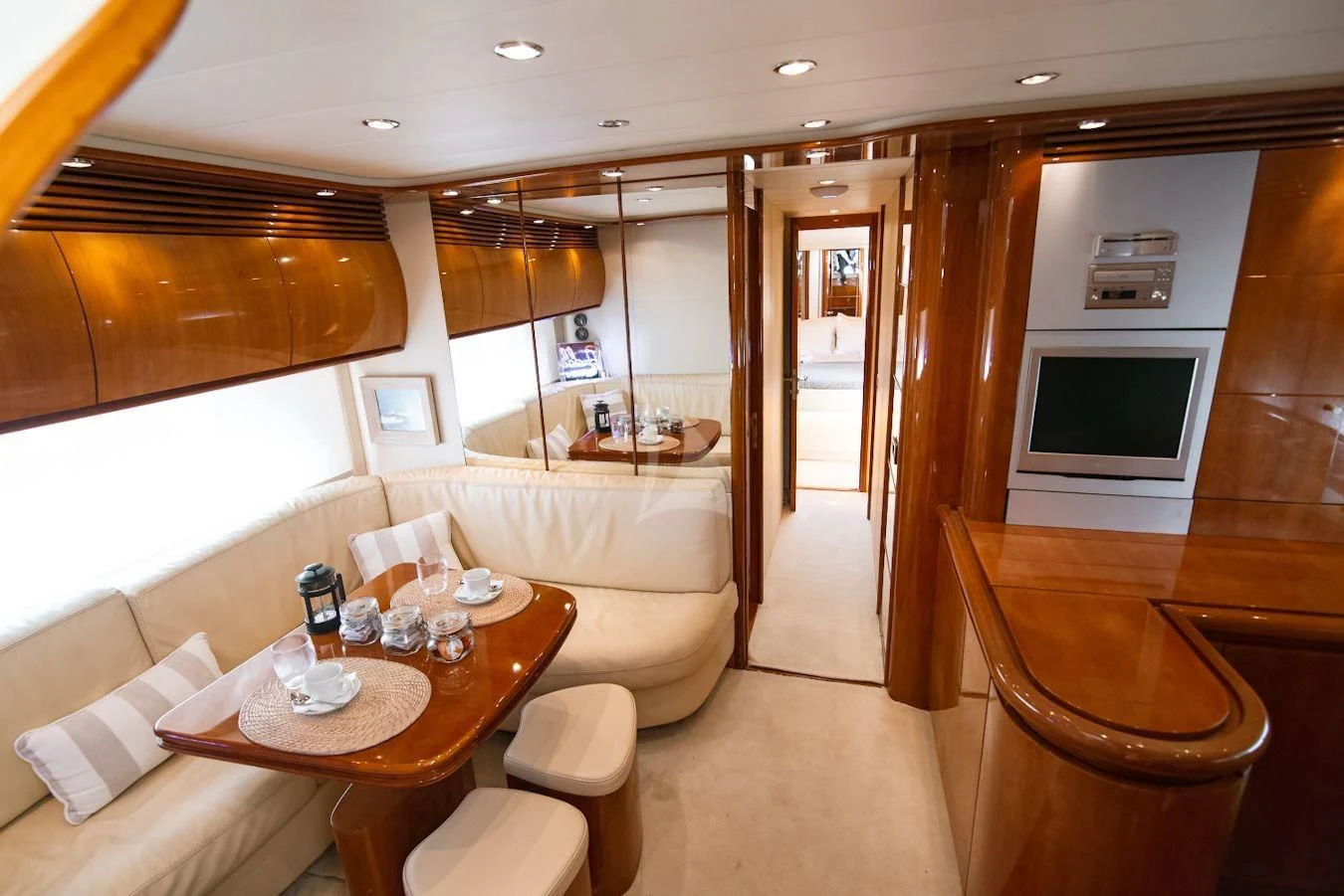 a room with a table and chairs aboard AXION Yacht for Charter