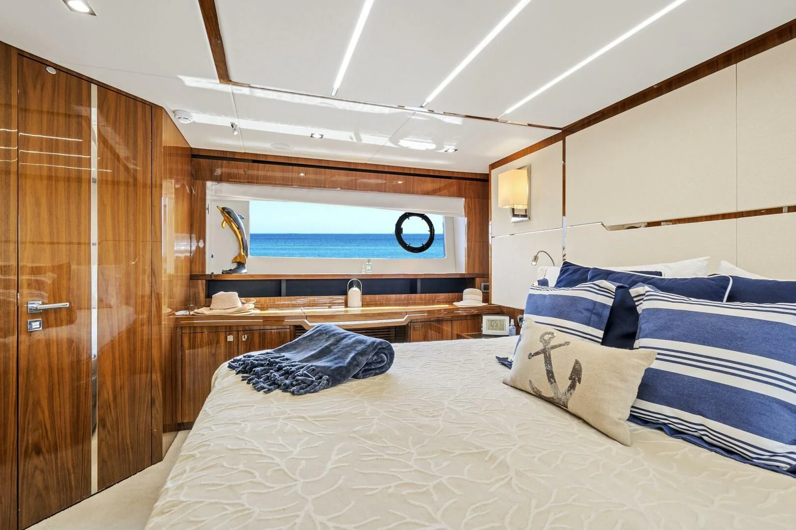 a room with a bed and a wood door aboard ONCE AROUND Yacht for Sale