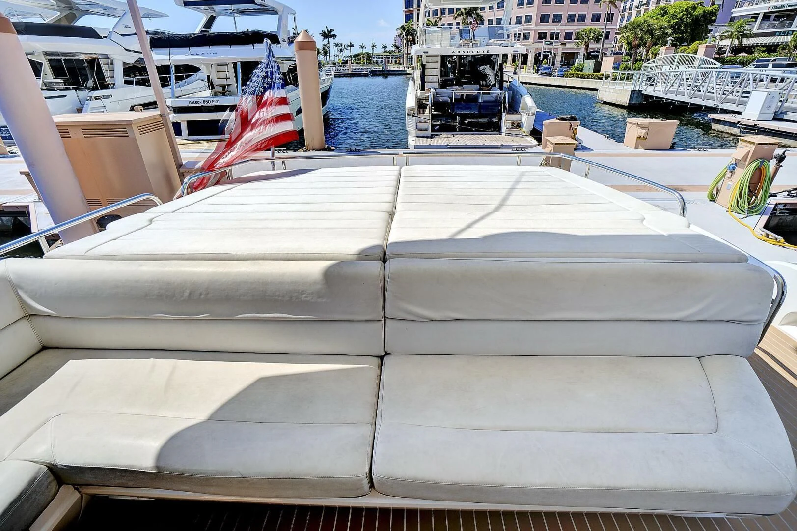a boat with a flag on the front aboard ONCE AROUND Yacht for Sale